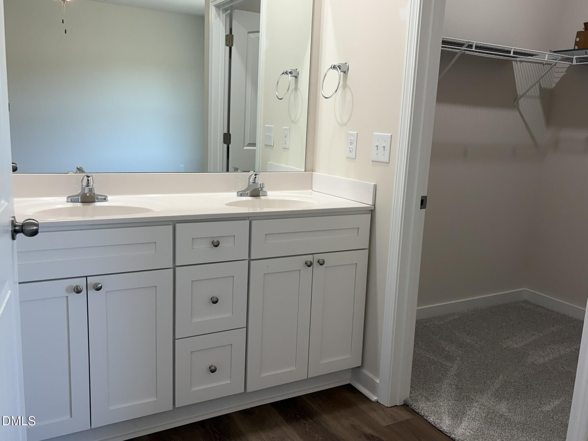 159 Jacobs Ridge Drive Four Oaks, NC 27524 - Photo 14 of 19 a bathroom with a double vanity sink and mirror