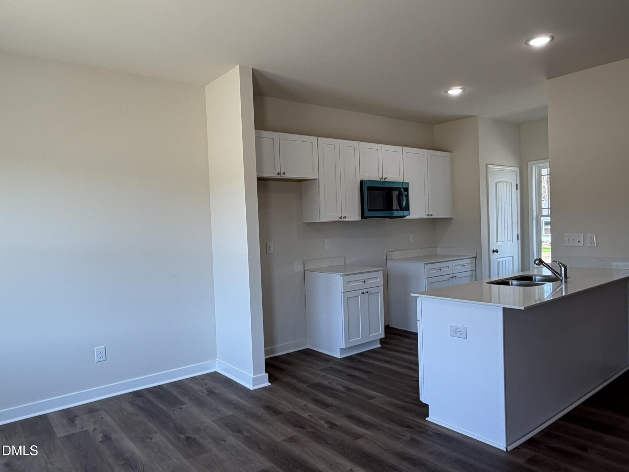 159 Jacobs Ridge Drive Four Oaks, NC 27524 - Photo 4 of 19 a kitchen with stainless steel appliances a microwave and sink