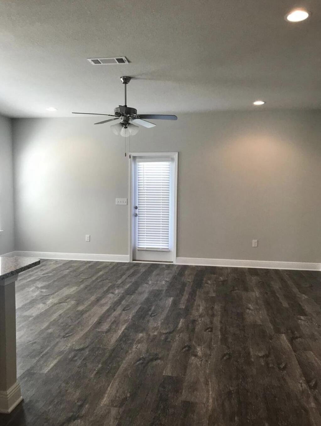 89 Crossing Lane, Unit A Santa Rosa Beach, FL 32459 - Photo 3 of 17 en empty room with windows and fan