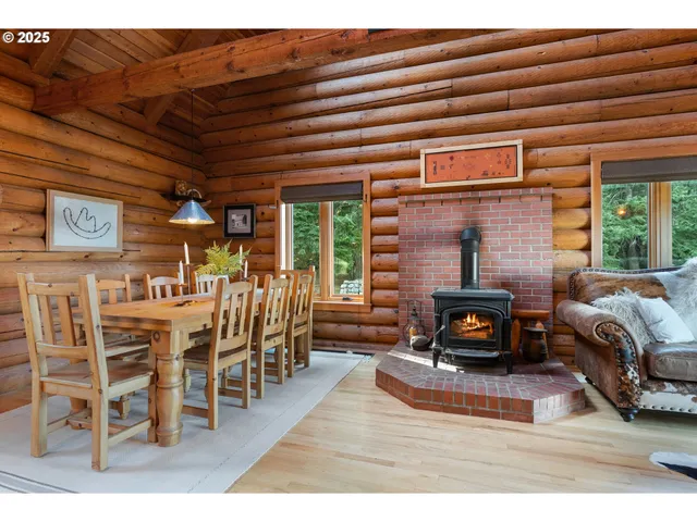 a living room with furniture a fireplace and a table