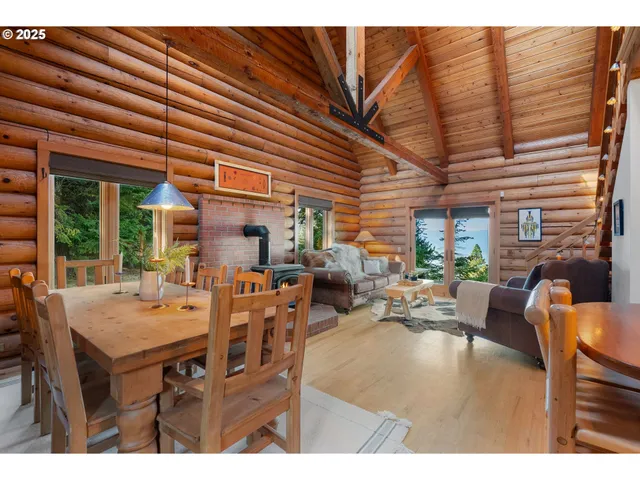 a dining room with furniture window and outside view