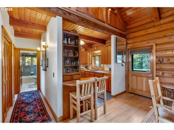 a dining room with furniture and wooden floor