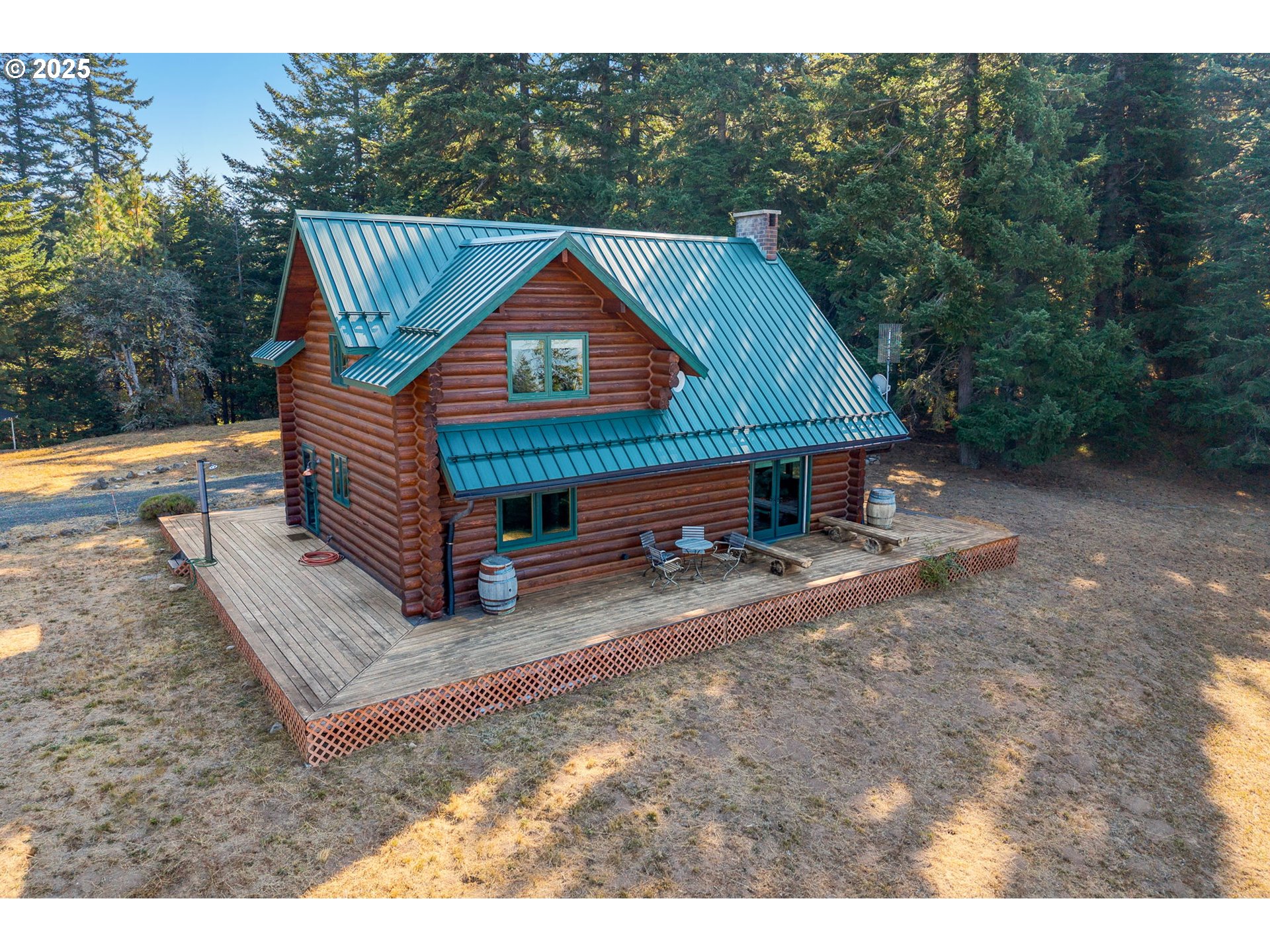 2300 Elder Road Hood River, OR 97031 - Photo 2 of 48 a backyard of a house with table and chairs
