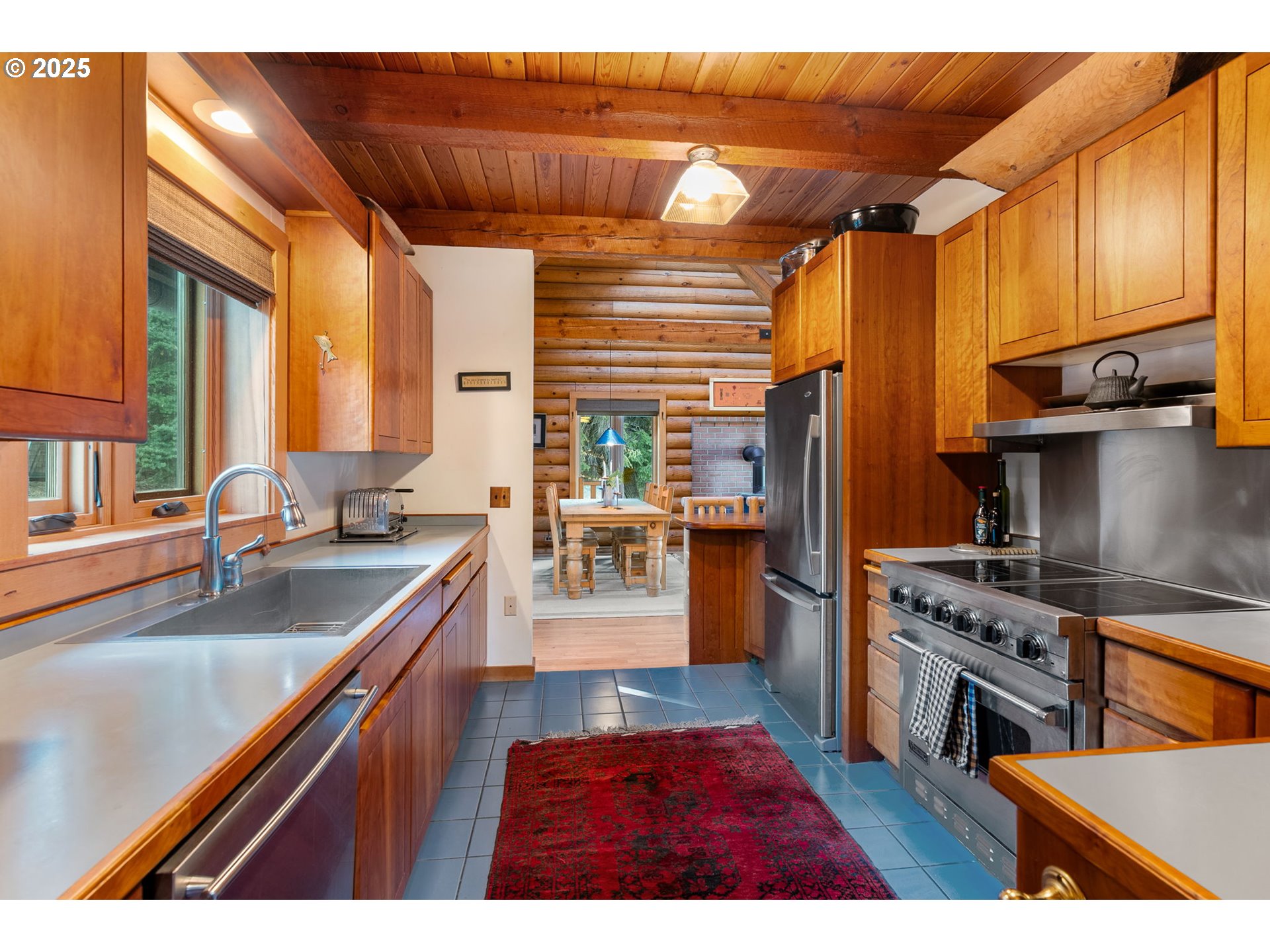 2300 Elder Road Hood River, OR 97031 - Photo 22 of 48 a kitchen with stainless steel appliances granite countertop a sink stove and refrigerator