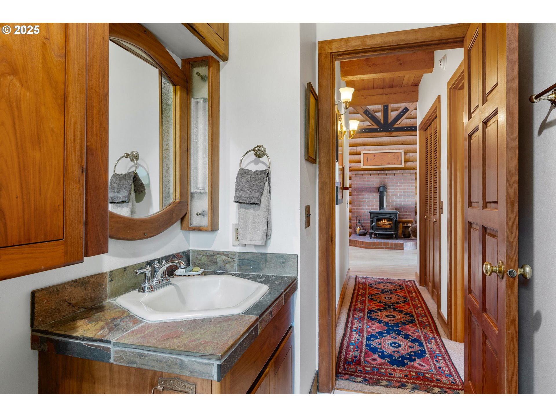 2300 Elder Road Hood River, OR 97031 - Photo 27 of 48 a en suite bathroom with a sink and a mirror