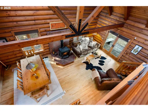 a bedroom with a bed a couch and dresser