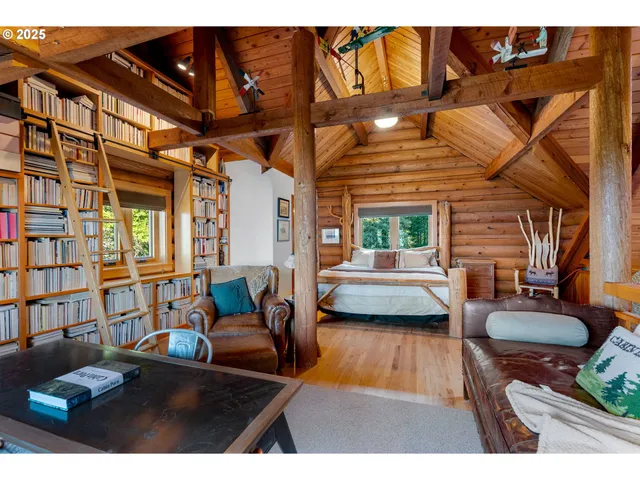 a view of living room with furniture and a rug