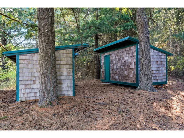a backyard of a house with outdoor seating