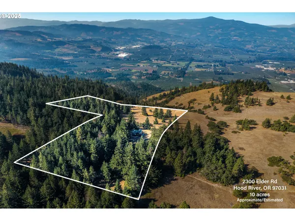 a aerial view of a house with a yard