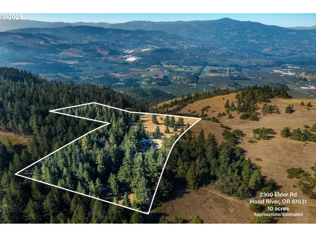 a aerial view of a house with a yard