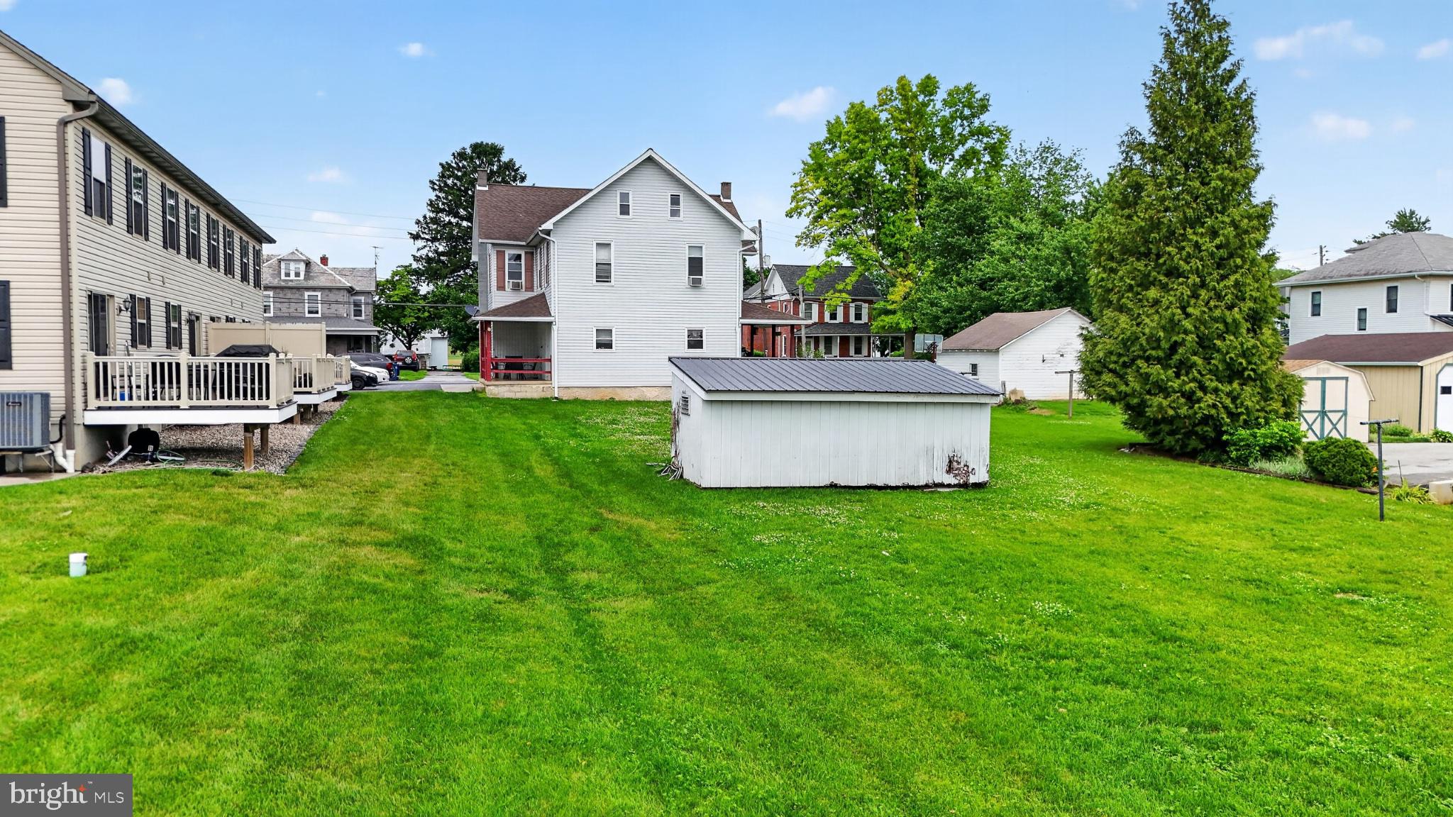 14 North Kinzer Road Kinzers, PA 17535 - Photo 29 of 34 Spacious backyard with lush greenery.