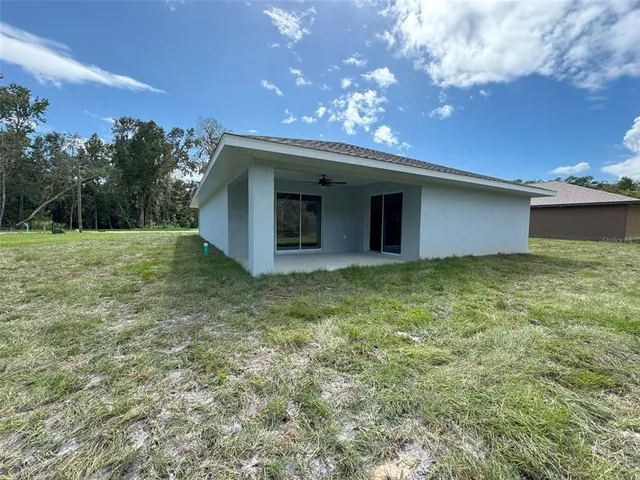 a backyard of a house with lots of green space