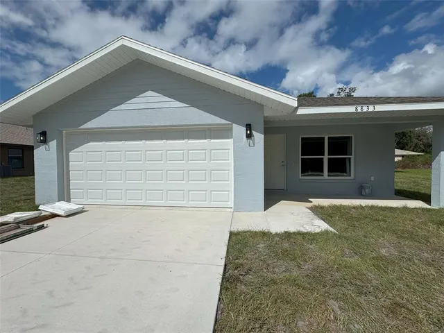 a front view of a house with a garage