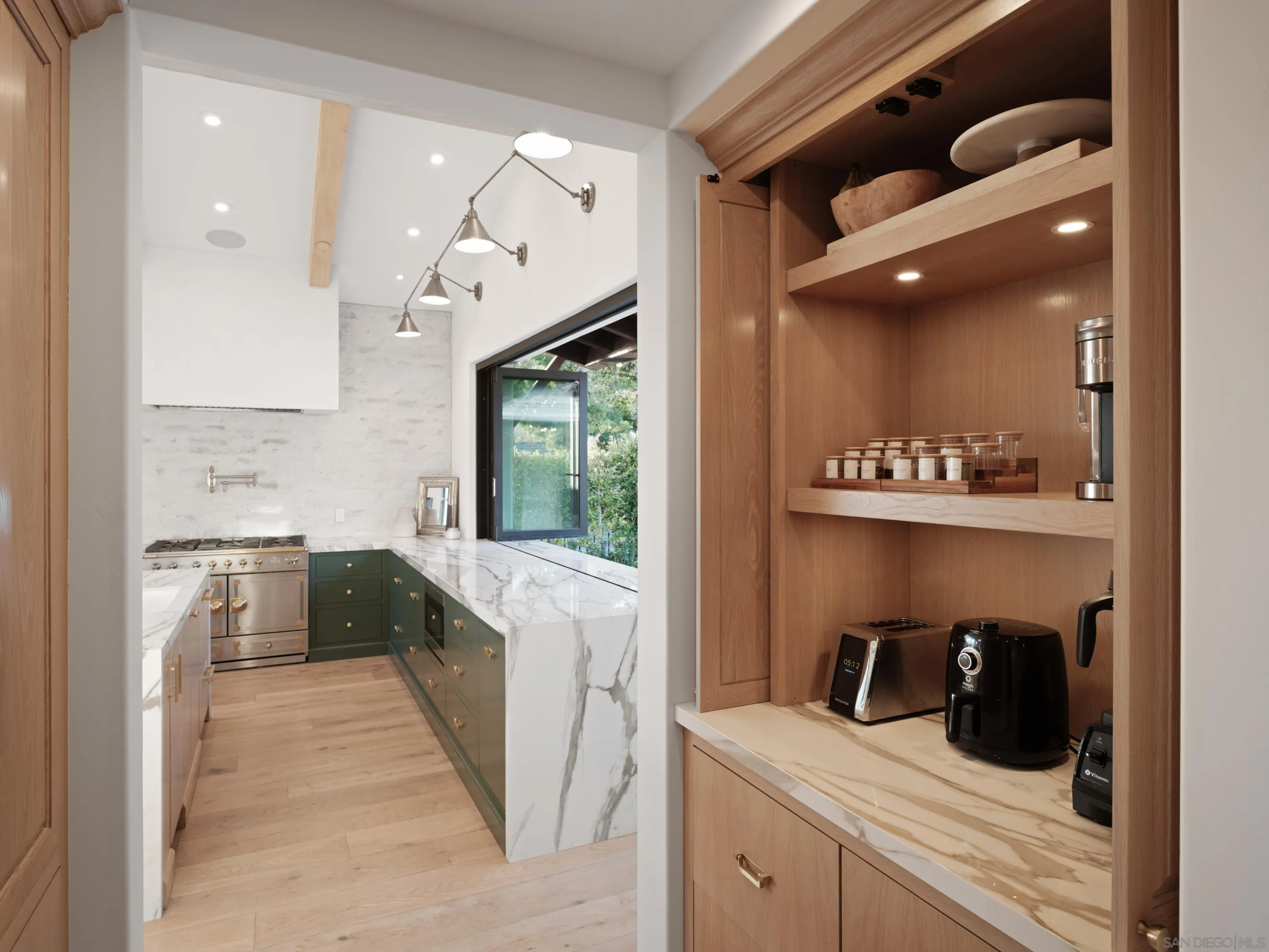 574 Amphitheatre Drive Del Mar, CA 92014 - Photo 18 of 37 a kitchen with a sink appliances and cabinets