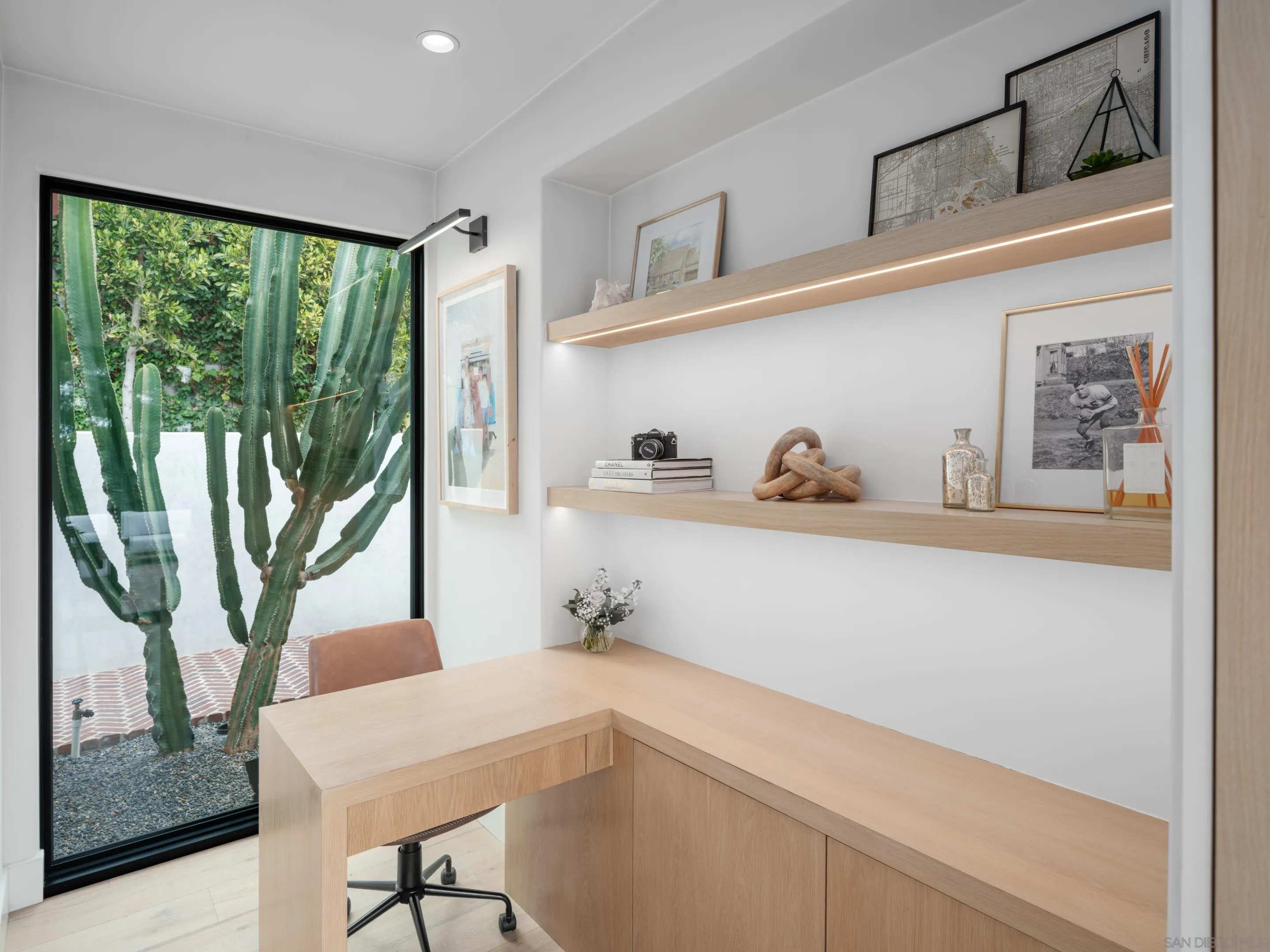 574 Amphitheatre Drive Del Mar, CA 92014 - Photo 24 of 37 a kitchen with a refrigerator a sink and cabinets