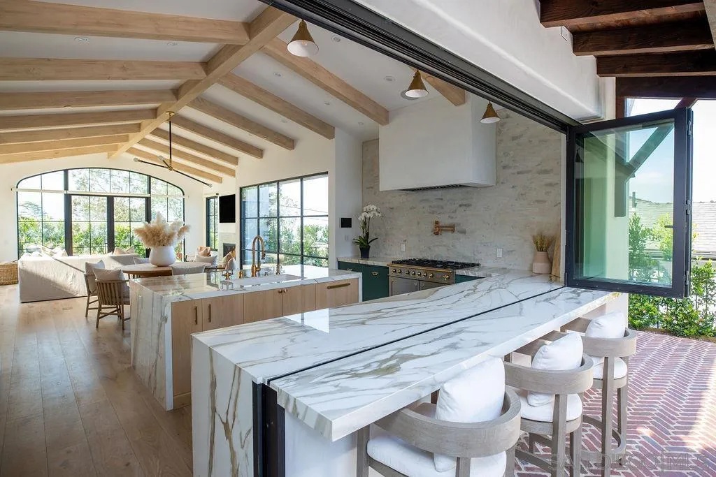 574 Amphitheatre Drive Del Mar, CA 92014 - Photo 8 of 37 a kitchen with a table and chairs in it