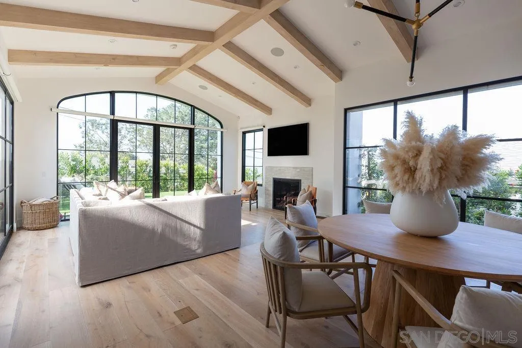 574 Amphitheatre Drive Del Mar, CA 92014 - Photo 10 of 37 a living room with furniture fireplace and a large window