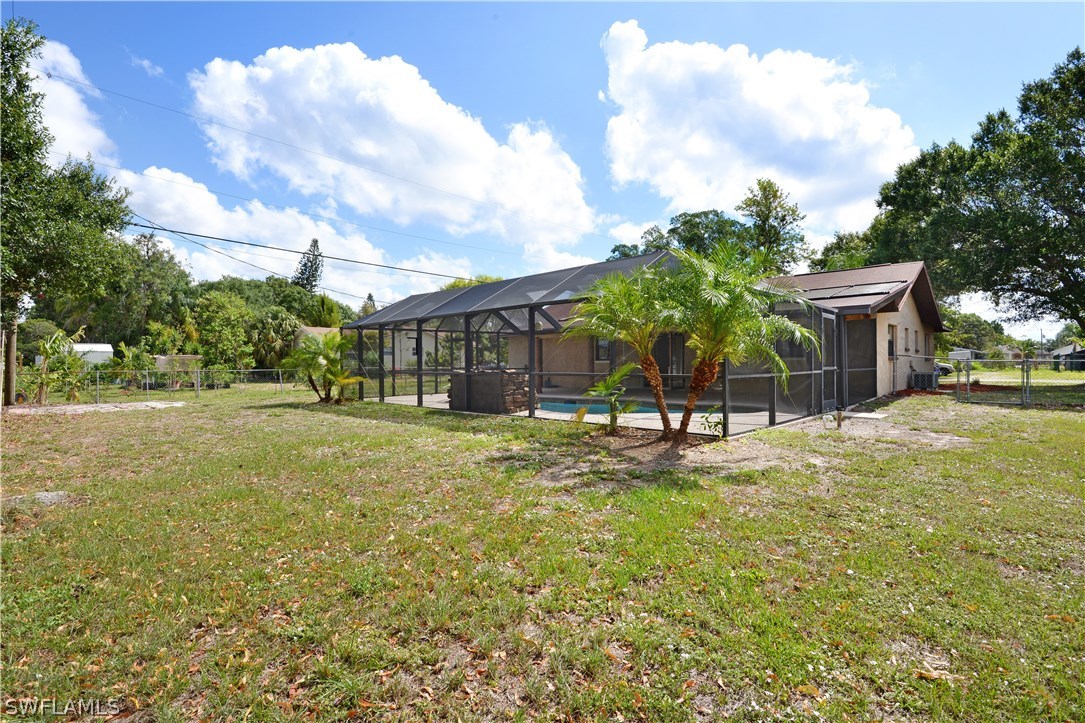 2231 Caladium Road Fort Myers, FL 33905 - Photo 23 of 25 a view of a house with pool and a yard