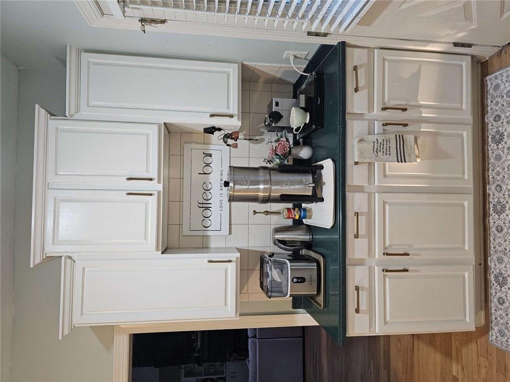 200 Chaparral Trace Tyrone, GA 30290 - Photo 13 of 52 a kitchen with stainless steel appliances granite countertop a stove a sink and a white cabinets