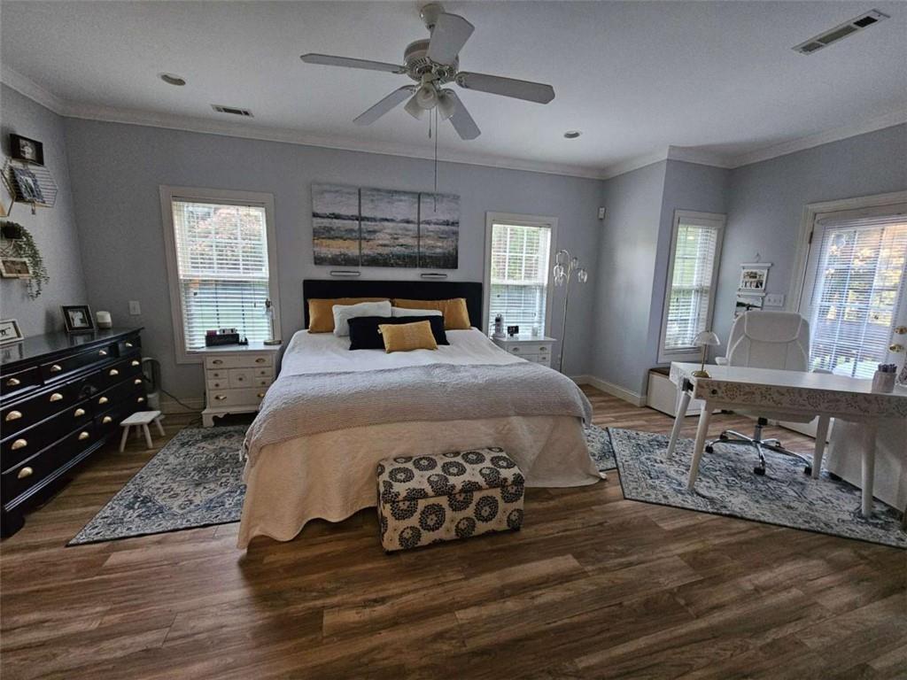 200 Chaparral Trace Tyrone, GA 30290 - Photo 19 of 52 a bedroom with a bed and wooden floor