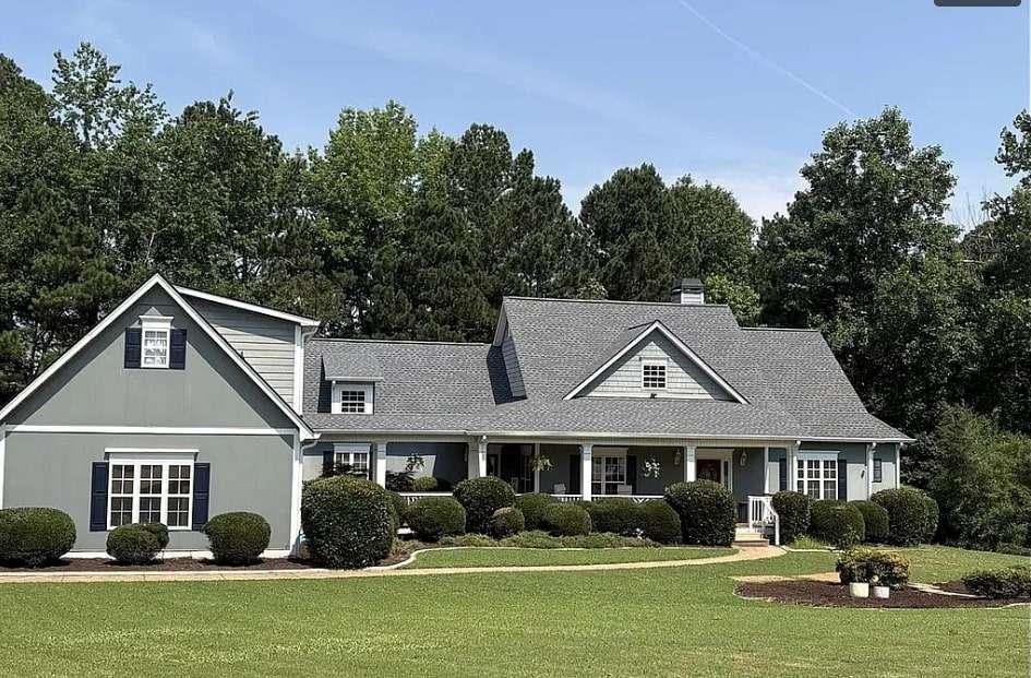200 Chaparral Trace Tyrone, GA 30290 - Photo 2 of 52 a front view of a house with garden space and trees
