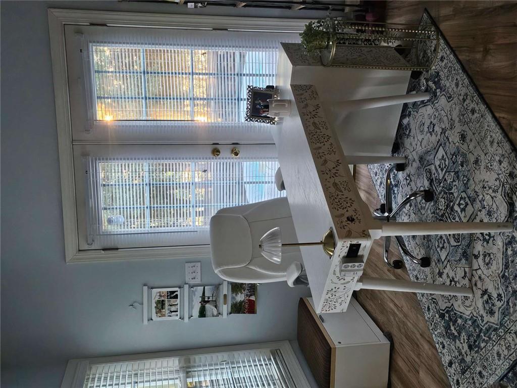 200 Chaparral Trace Tyrone, GA 30290 - Photo 21 of 52 a living room with furniture and a floor to ceiling window