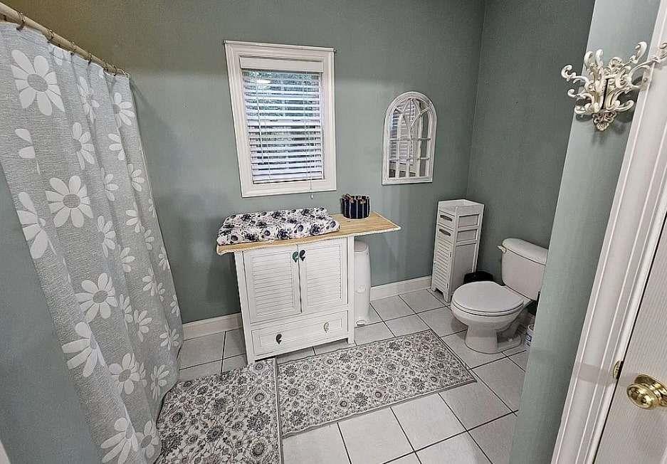 200 Chaparral Trace Tyrone, GA 30290 - Photo 31 of 52 a bathroom with a toilet sink and mirror
