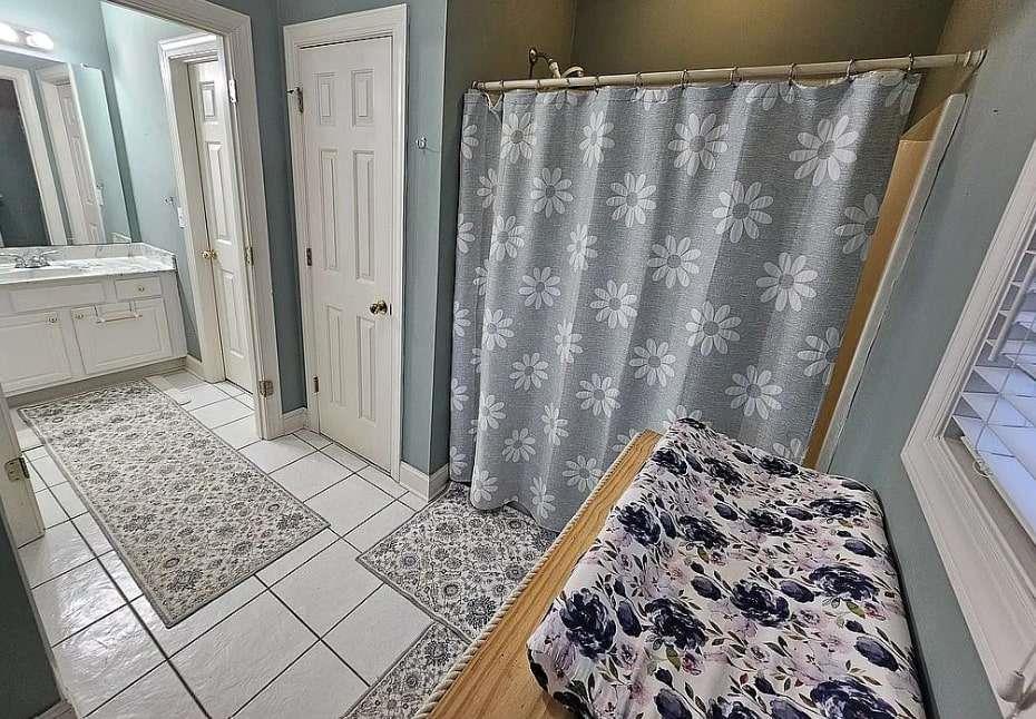 200 Chaparral Trace Tyrone, GA 30290 - Photo 32 of 52 a view of a bathroom with sink and shower