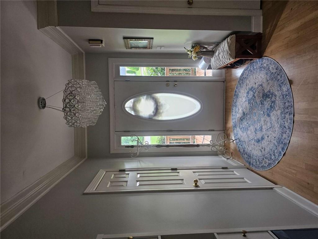 200 Chaparral Trace Tyrone, GA 30290 - Photo 4 of 52 wooden floor with a large mirror of a couches