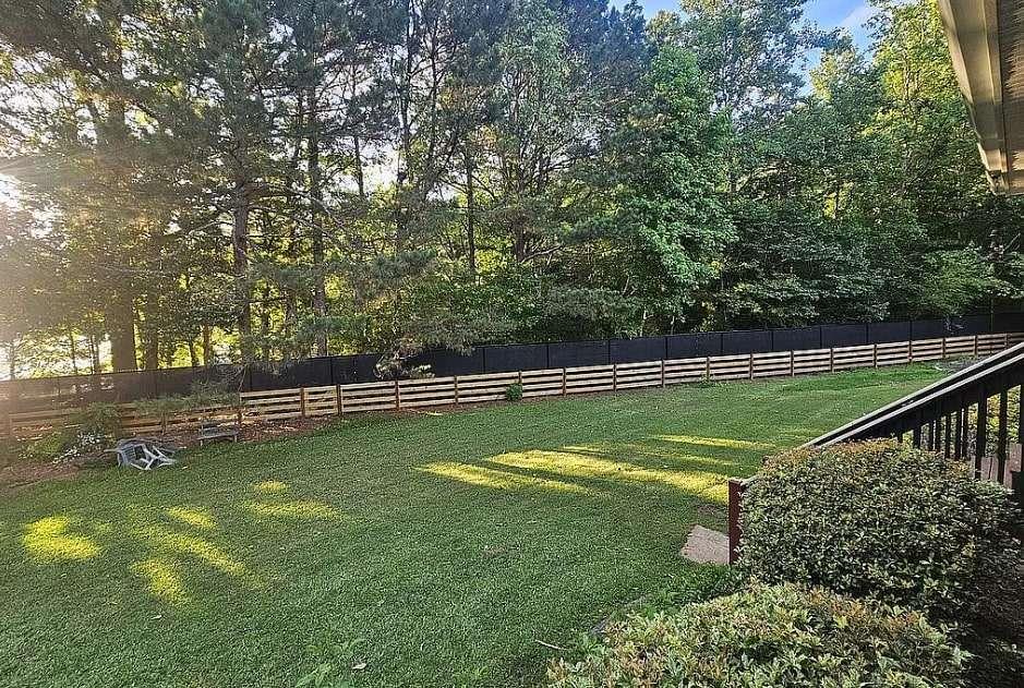 200 Chaparral Trace Tyrone, GA 30290 - Photo 46 of 52 a view of a swimming pool with a bench in the background