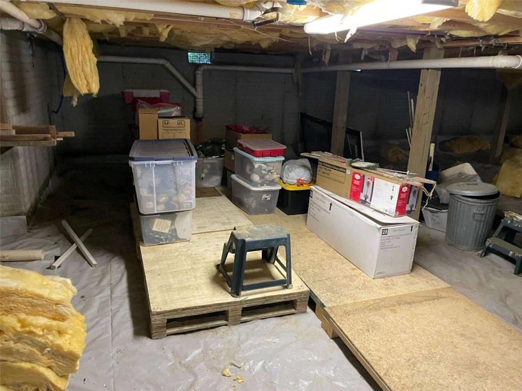 200 Chaparral Trace Tyrone, GA 30290 - Photo 51 of 52 a storage room with water heater and racks