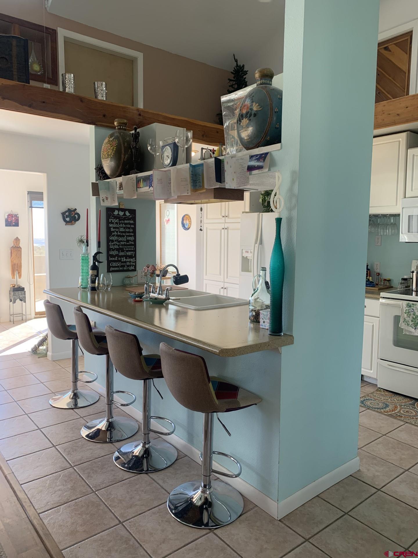 17679 2550 Road Cedaredge, CO 81413 - Photo 14 of 35 a kitchen with stainless steel appliances granite countertop a sink and cabinets