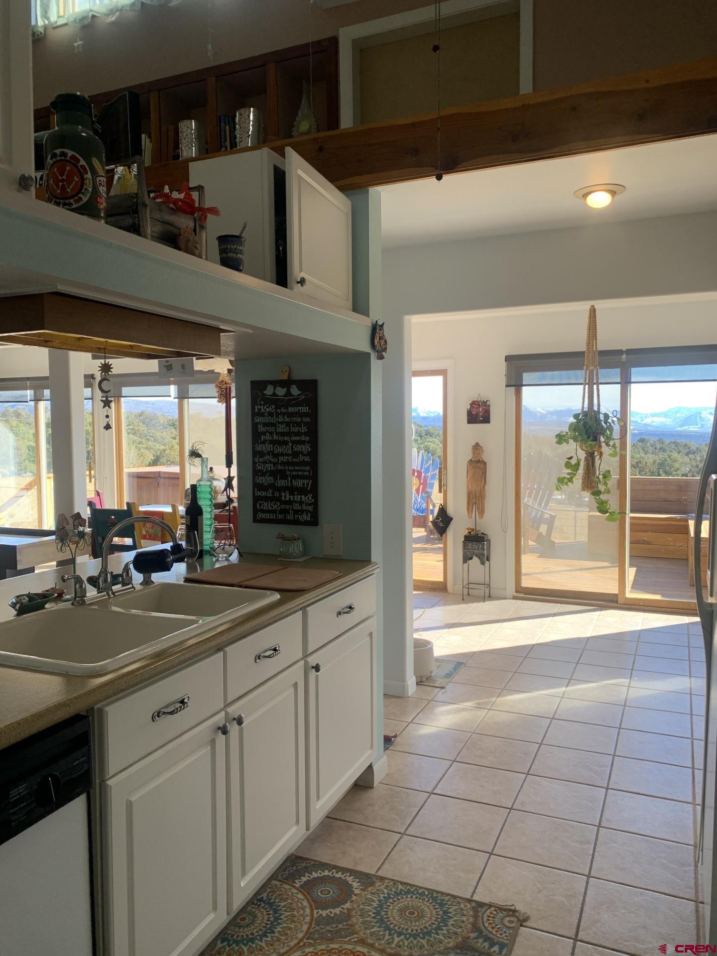 17679 2550 Road Cedaredge, CO 81413 - Photo 17 of 35 a open kitchen with stainless steel appliances a sink stove and cabinets