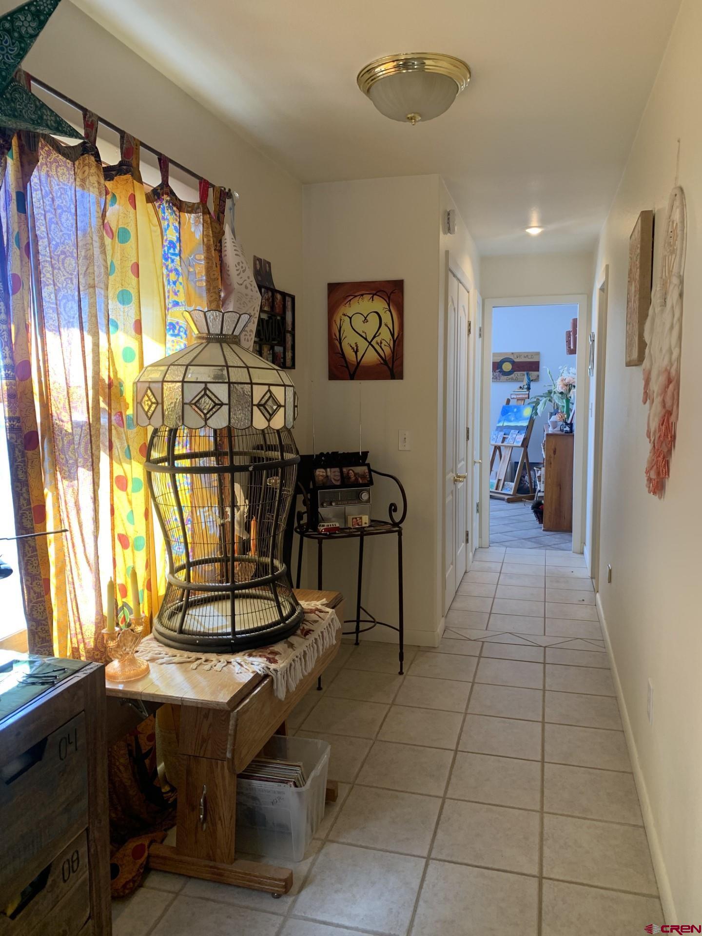 17679 2550 Road Cedaredge, CO 81413 - Photo 25 of 35 a view of a entryway with furniture and a window