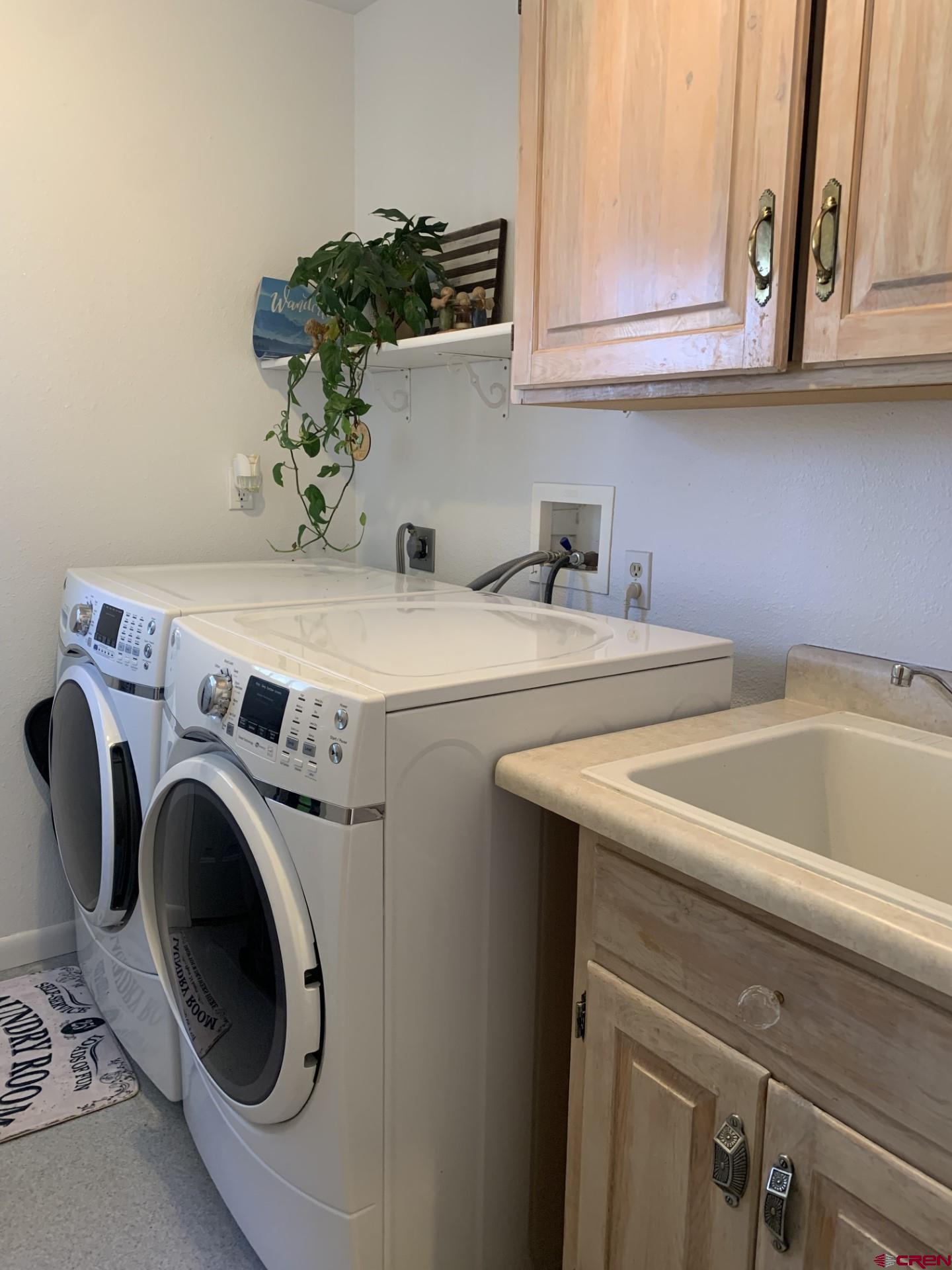 17679 2550 Road Cedaredge, CO 81413 - Photo 26 of 35 a utility room with dryer and washer