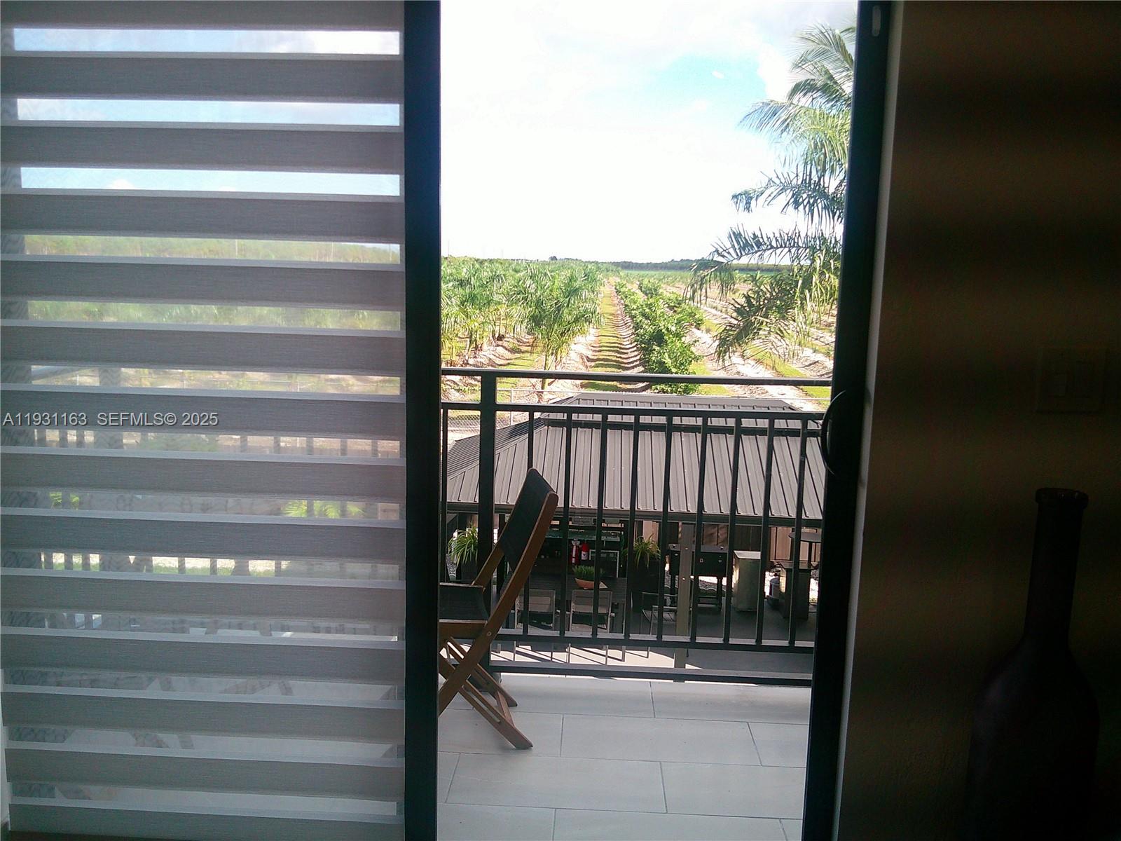 26831 Southwest 119th Court Homestead, FL 33032 - Photo 11 of 27 a view of a glass door of the house