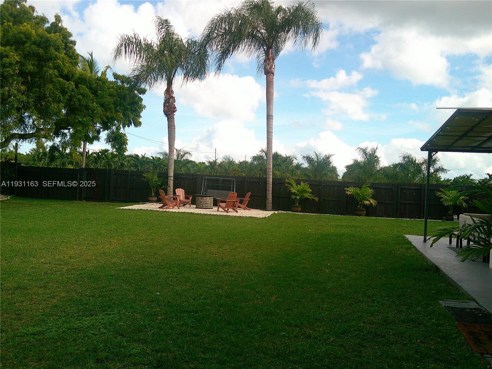 26831 Southwest 119th Court Homestead, FL 33032 - Photo 3 of 27 a view of building and green space