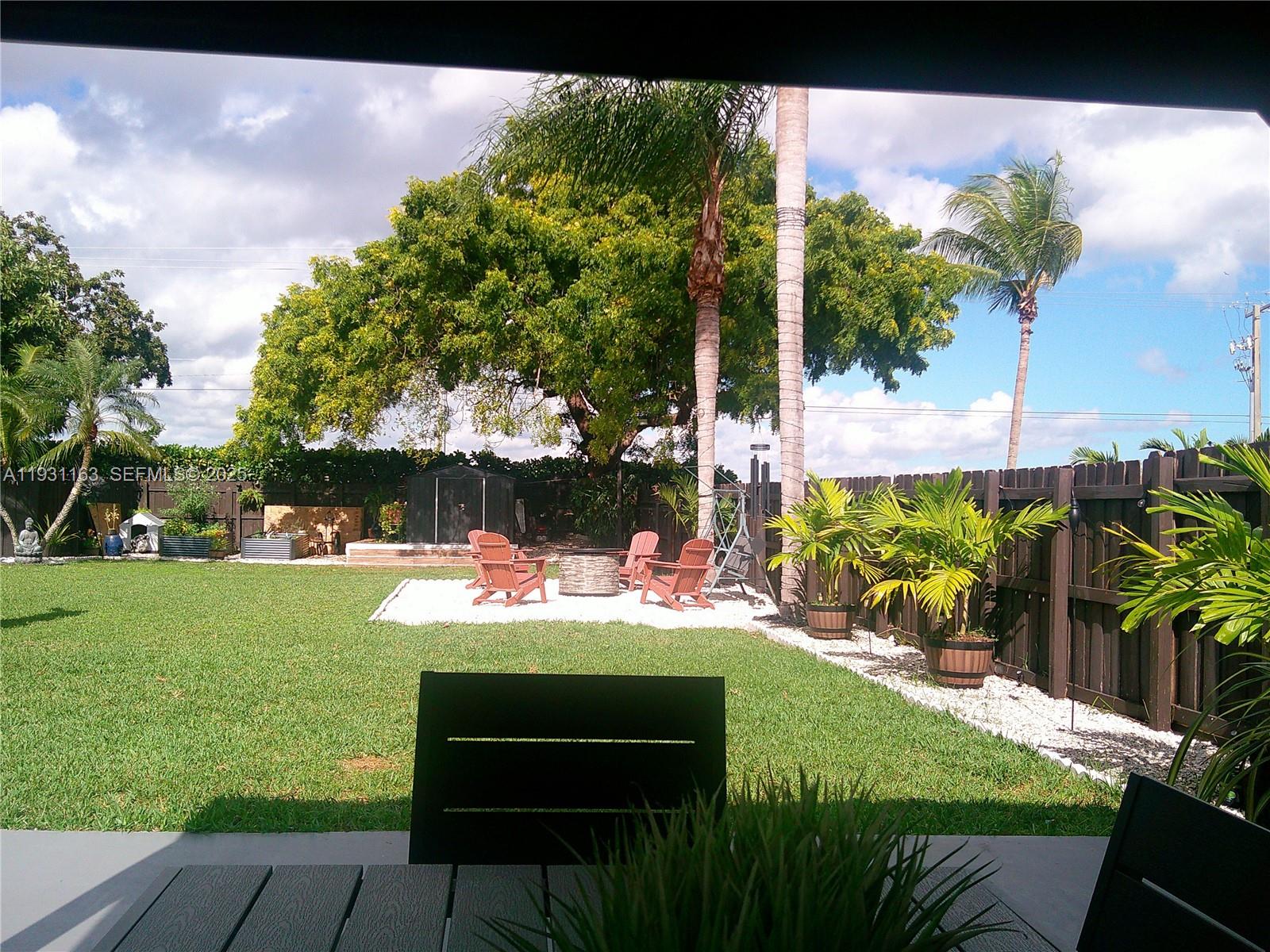 26831 Southwest 119th Court Homestead, FL 33032 - Photo 4 of 27 a view of an outdoor sitting space