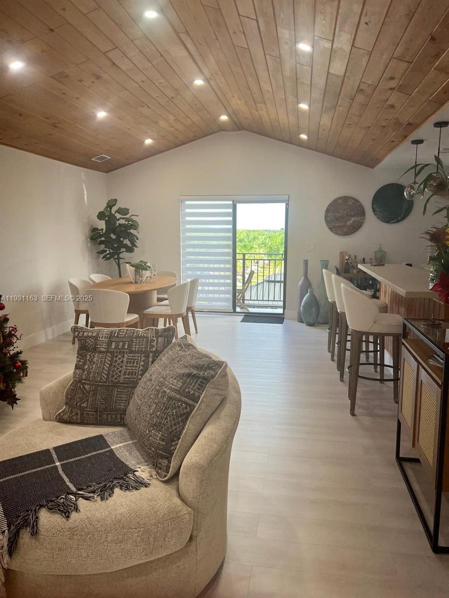 26831 Southwest 119th Court Homestead, FL 33032 - Photo 8 of 27 a living room with furniture and a large window