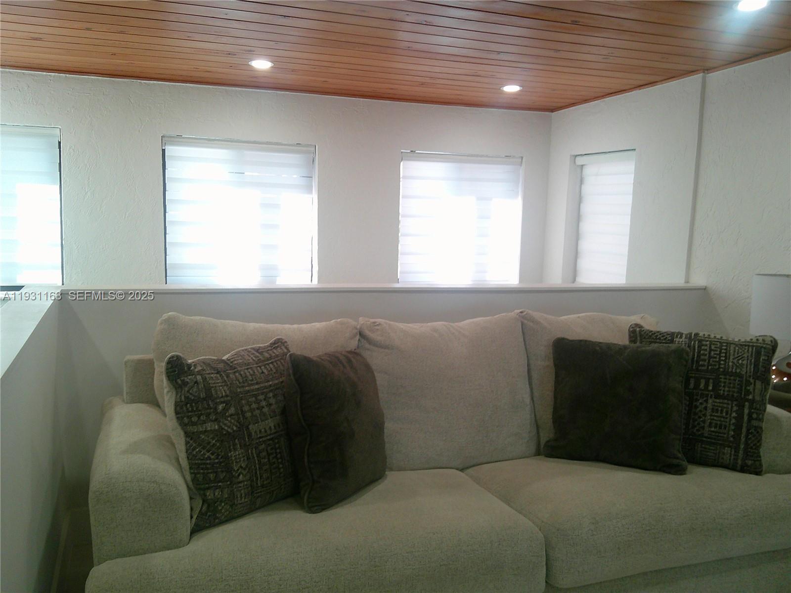 26831 Southwest 119th Court Homestead, FL 33032 - Photo 9 of 27 a living room with furniture and a window
