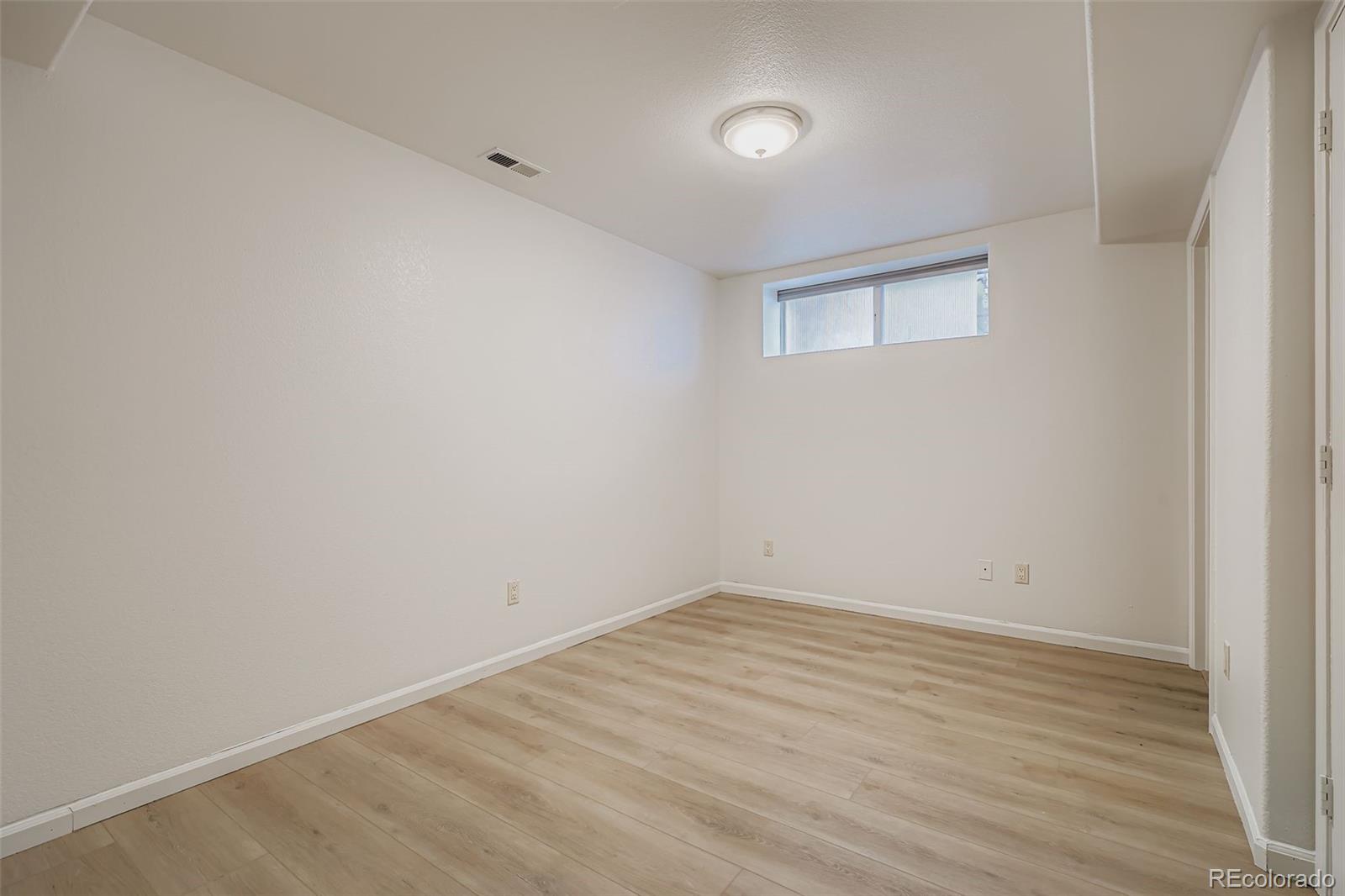714 East 18th Avenue Denver, CO 80203 - Photo 11 of 20 wooden floor in an empty room