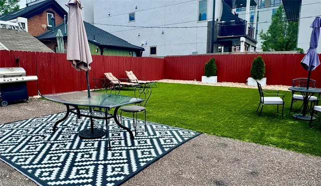 a view of a chairs and table in patio