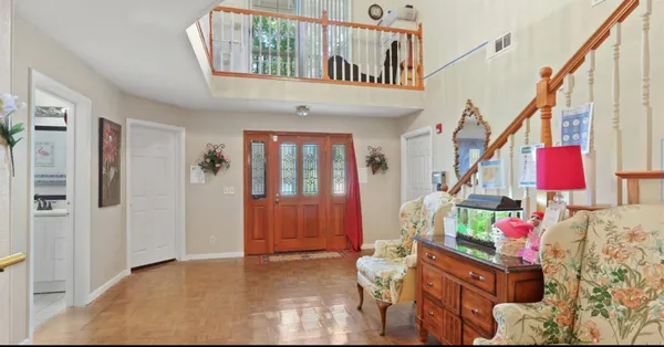 a view of entryway with an entryway and wooden floor