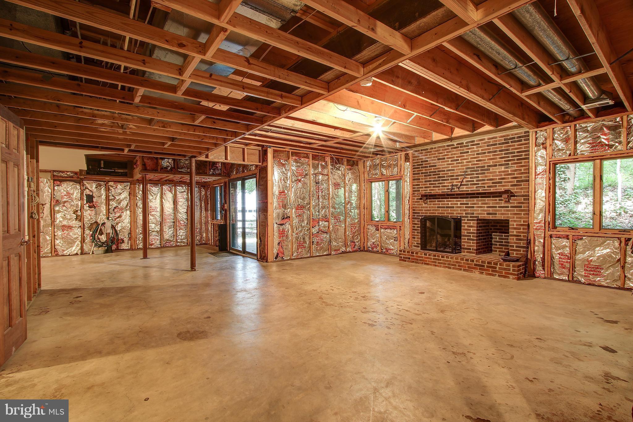 6131 Garden Road Springfield, VA 22152 - Photo 22 of 29 Unfinished lower level with fireplace