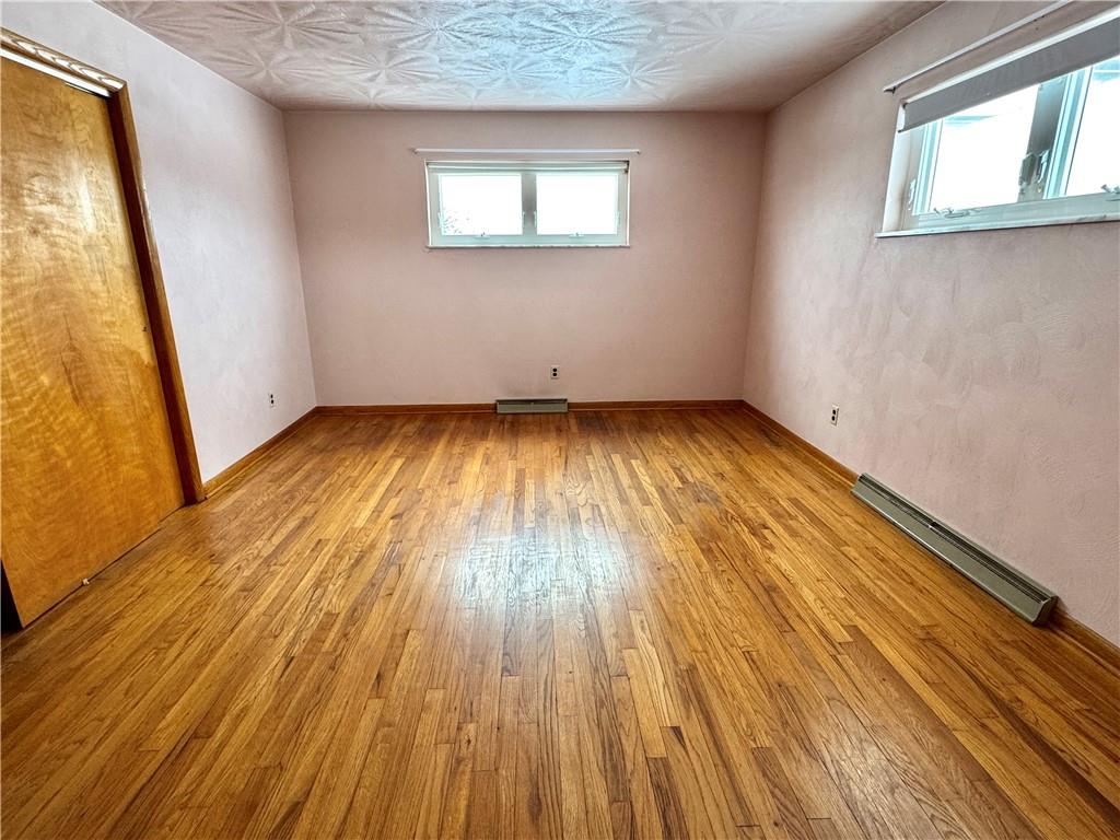 260 Simon Drive Butler, PA 16002 - Photo 15 of 46 an empty room with wooden floor and windows