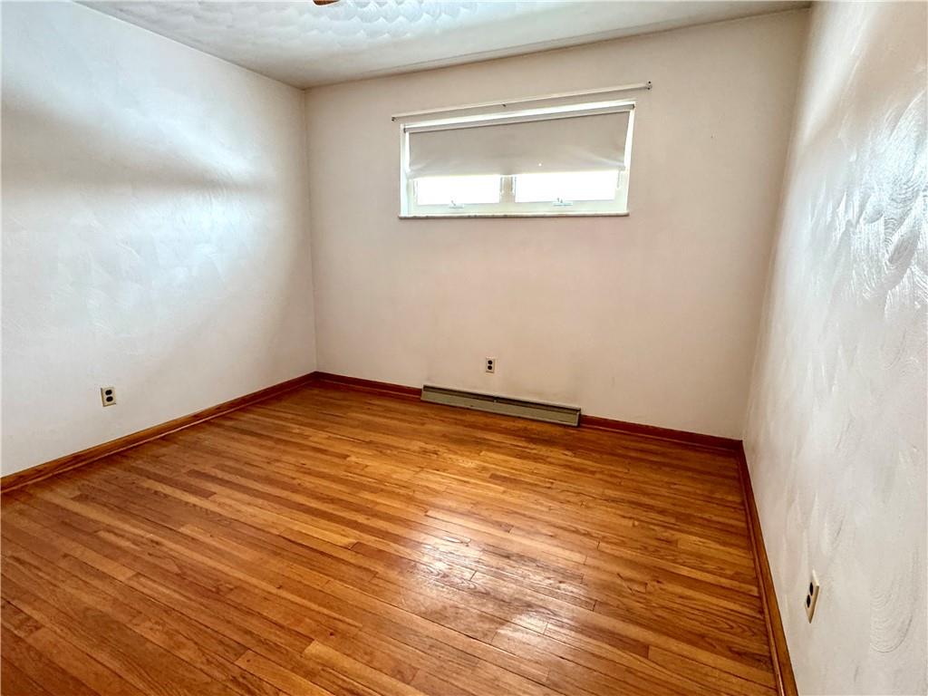 260 Simon Drive Butler, PA 16002 - Photo 19 of 46 a view of an empty room with wooden floor