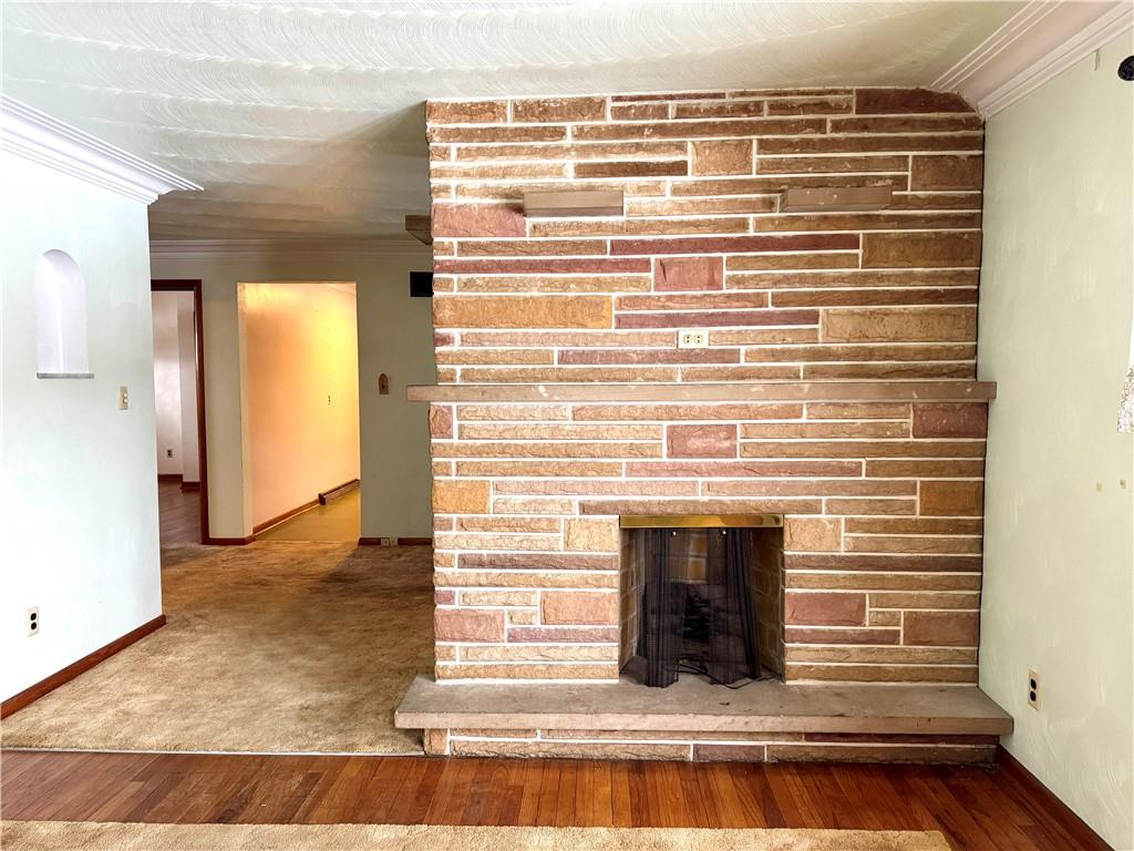 260 Simon Drive Butler, PA 16002 - Photo 4 of 46 a view of fireplace and a wooden floor