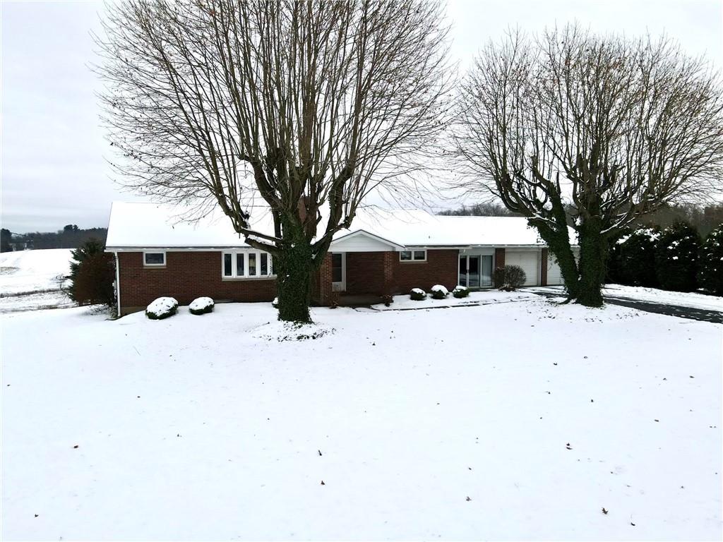 260 Simon Drive Butler, PA 16002 - Photo 45 of 46 a view of house with a yard covered in snow