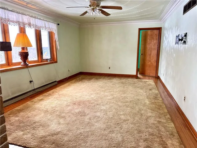 a view of a room with window and mirror