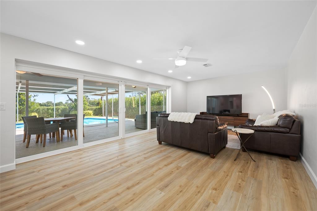 656 Mehlenbacher Road Belleair, FL 33756 - Photo 18 of 49 a living room with furniture and a flat screen tv